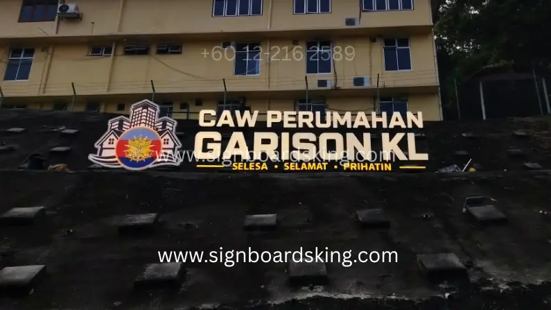 Custom 3D Box-Up Signage for CAW Perumahan Garison KL with large lettering and logo installed outdoors.