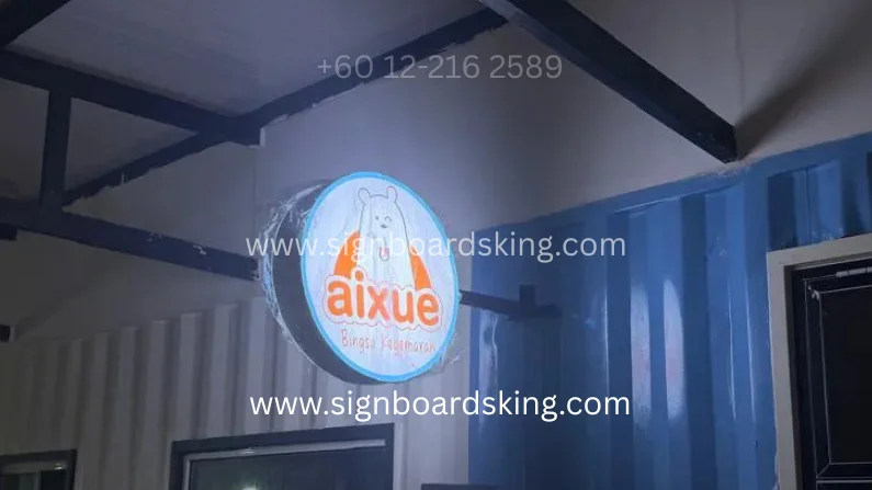 Round lightbox AIXUE dengan pencahayaan LED terang dan reka bentuk bulat moden, meningkatkan visibility premis siang dan malam